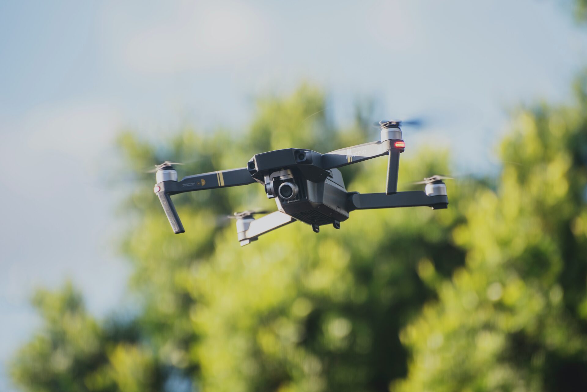 Flying Drone With Trees on the Background